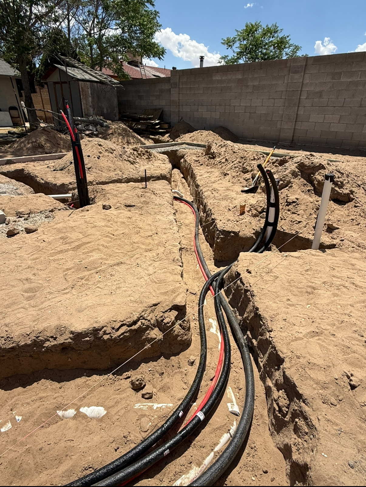 Trenching with multiple conduits laid side by side